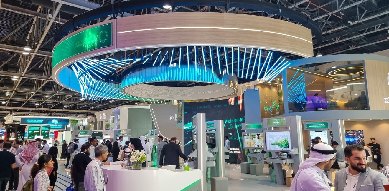 Visitors walking through DEWA Dubai Electricity and water Authority pavilion at 43rd GITEX Global 2023, largest tech and startup event in the world in Dubai, United Arab Emirates - O