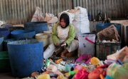 a woman sorting plastic waste