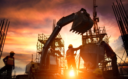 Backlit construction site with skeleton buildings