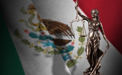 Mexico flag with statue of lady justice and judicial scales in dark room. Concept of judgement and punishment, background for jury topics